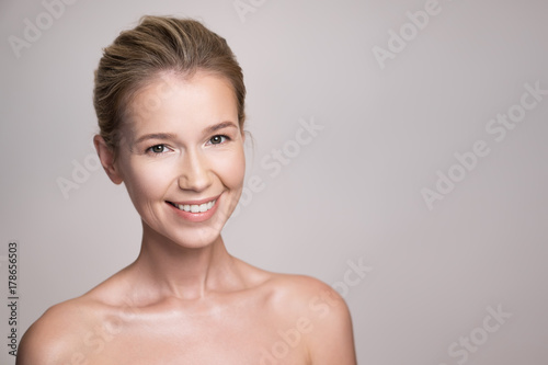 Beauty portrait of attractive middle age blonde woman with perfect skin.