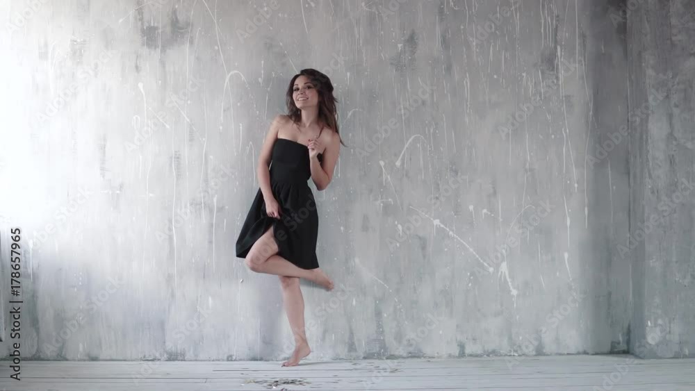 compilation 3 different clips. attractive girl in black dress with evening make-up. girl fools around and smiles against a light background compilation 3 different clips. attractive girl in black dress with evening make-up. girl fools around and smiles against a light background