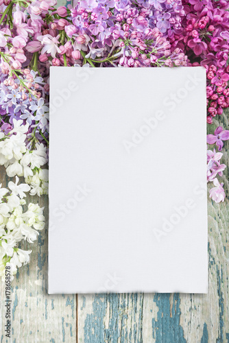 Lush multicolored bunches of lilac and paper card