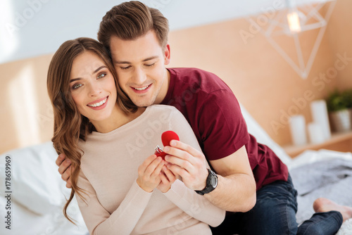 Canvas-taulu Smiling lady enjoying proposal moment at home