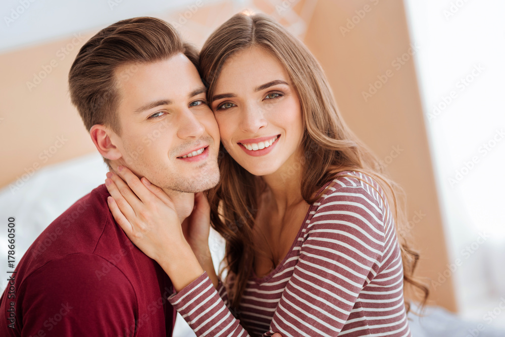 Radiant couple grinning broadly into camera Radiant couple grinning broadly into camera