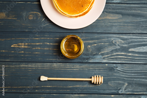 Tasty healthy breakfast - fresh pancakes with honey