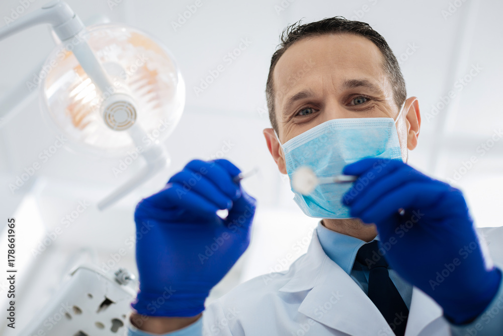 Delighted positive doctor looking at you Delighted positive doctor looking at you