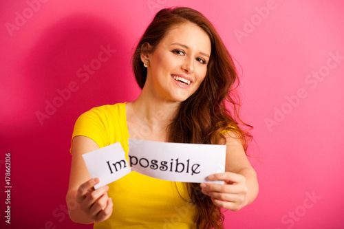 Young woman tears appart twext impossible  photo