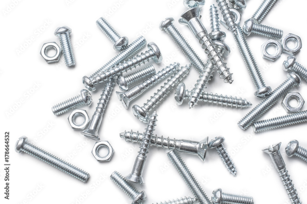 Macro Of A Medium Size Collection Of Iron Screws And Bolts In A Whitebox Macro Of A Medium Size Collection Of Iron Screws And Bolts In A Whitebox