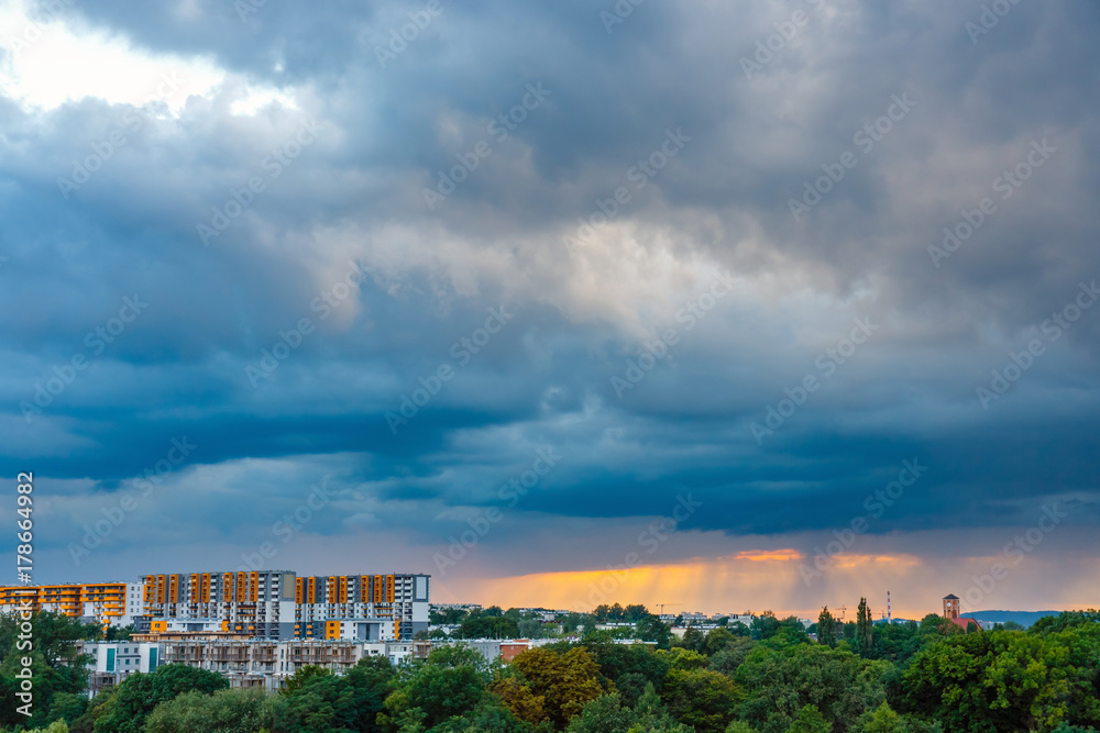 A huge storm cloud with a wall of rain over the city A huge storm cloud with a wall of rain over the city