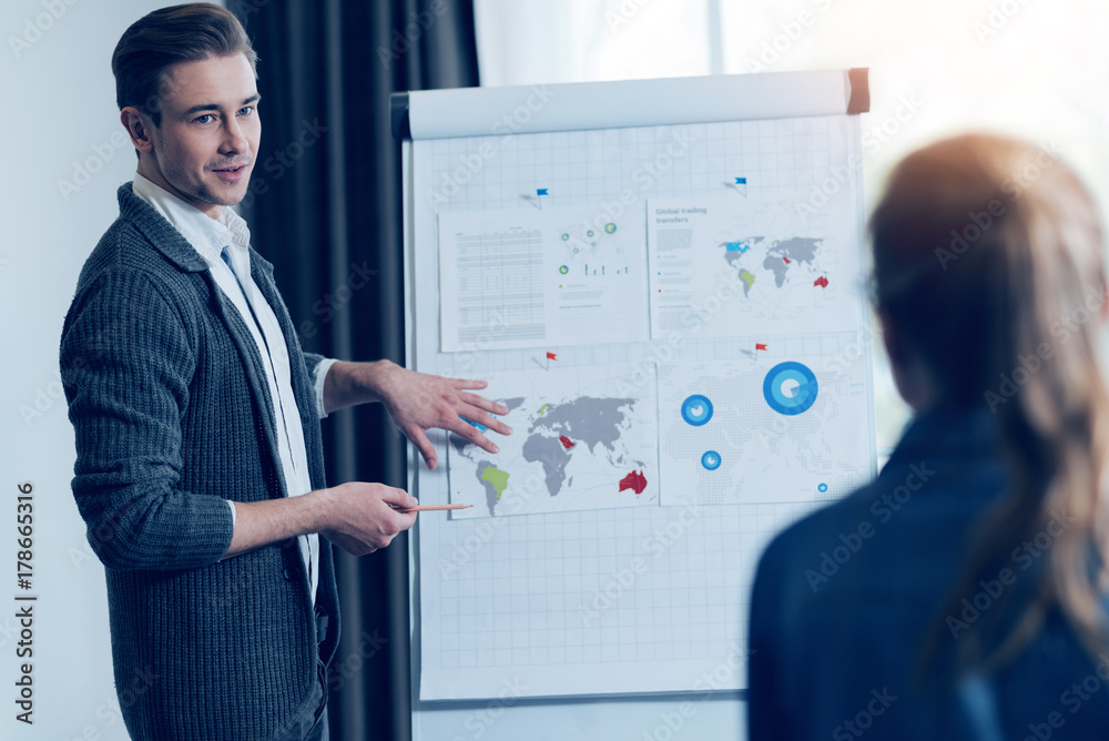 Confident designer looking at his colleague Confident designer looking at his colleague