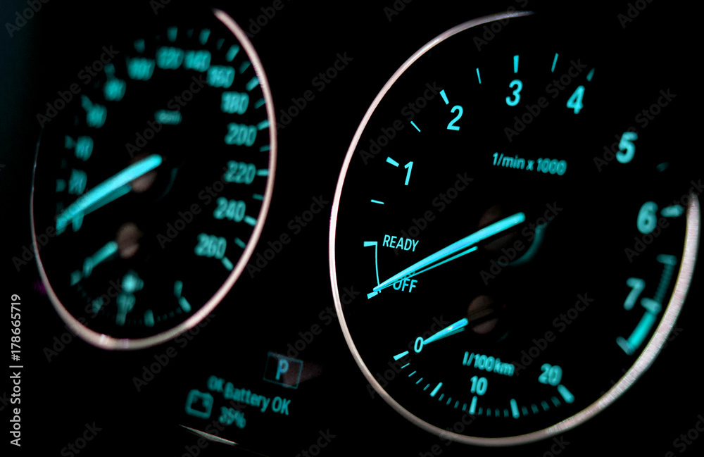 Car speedometer on black background