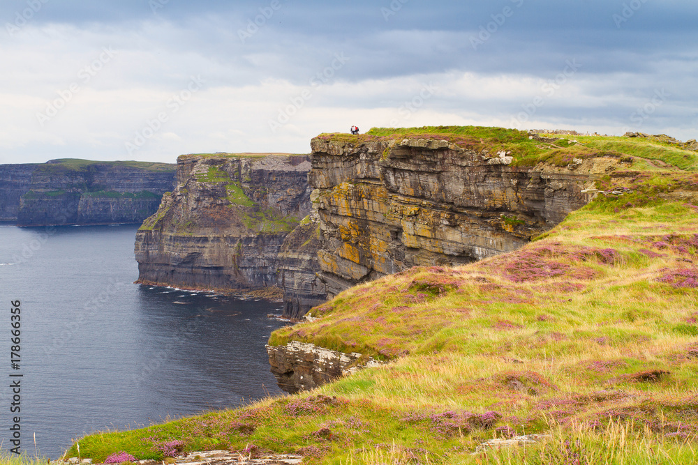 Cliffs of Moher, west coast of Ireland, County Clare on wild Atlantic ocean. Photo of a beautiful scenic sea and sky landscape. View of ocean scenery, horizontal