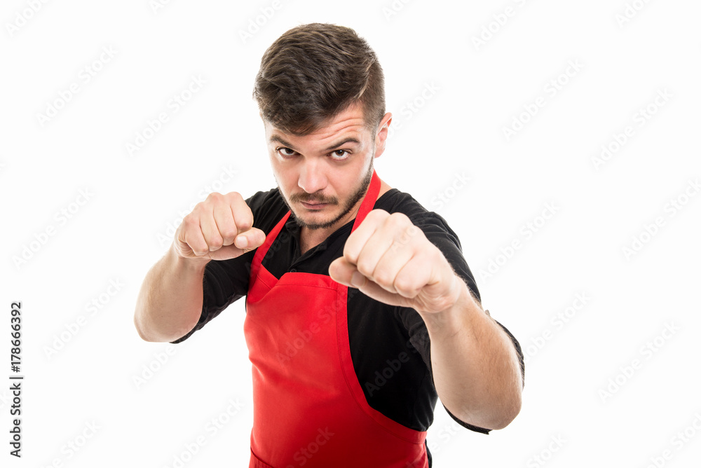 Male supermarket employer holding fists in fighting position