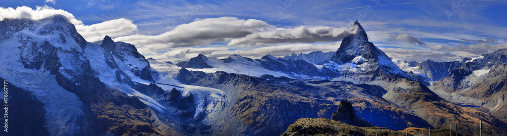 Amazing View of the panorama mountain range near the Matterhorn in the Swiss Alps. Amazing View of the panorama mountain range near the Matterhorn in the Swiss Alps.