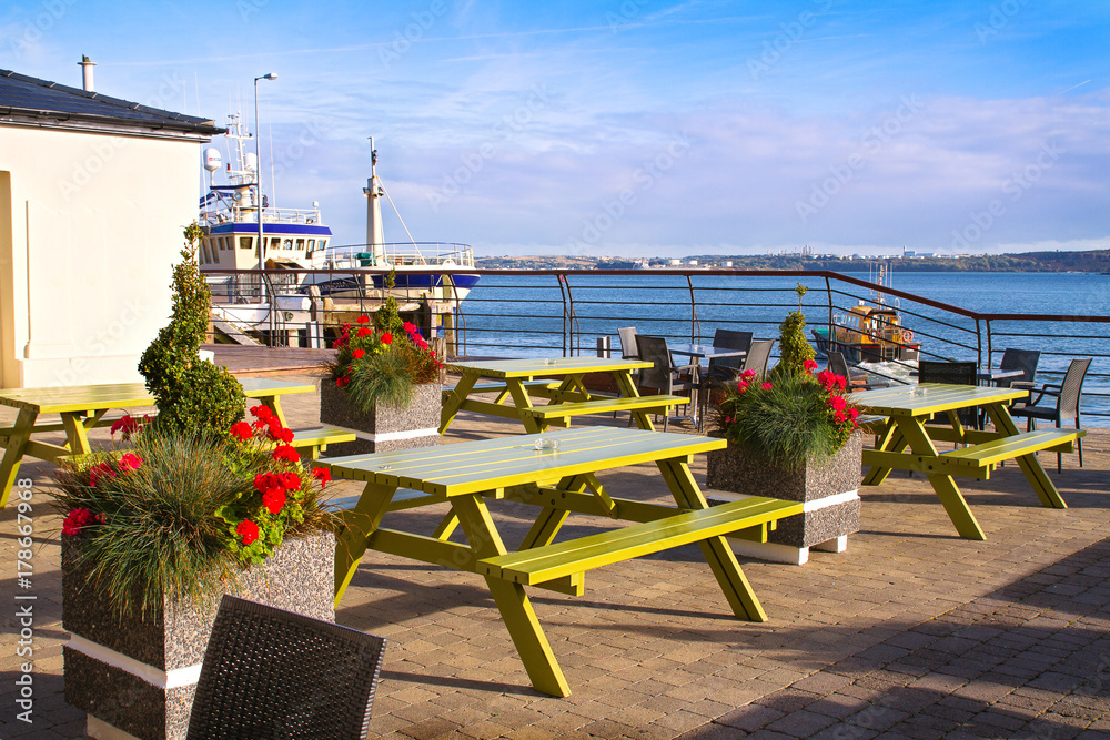 Cafe with view at harbour in tourist seaport town. Cobh, Ireland Cafe with view at harbour in tourist seaport town. Cobh, Ireland