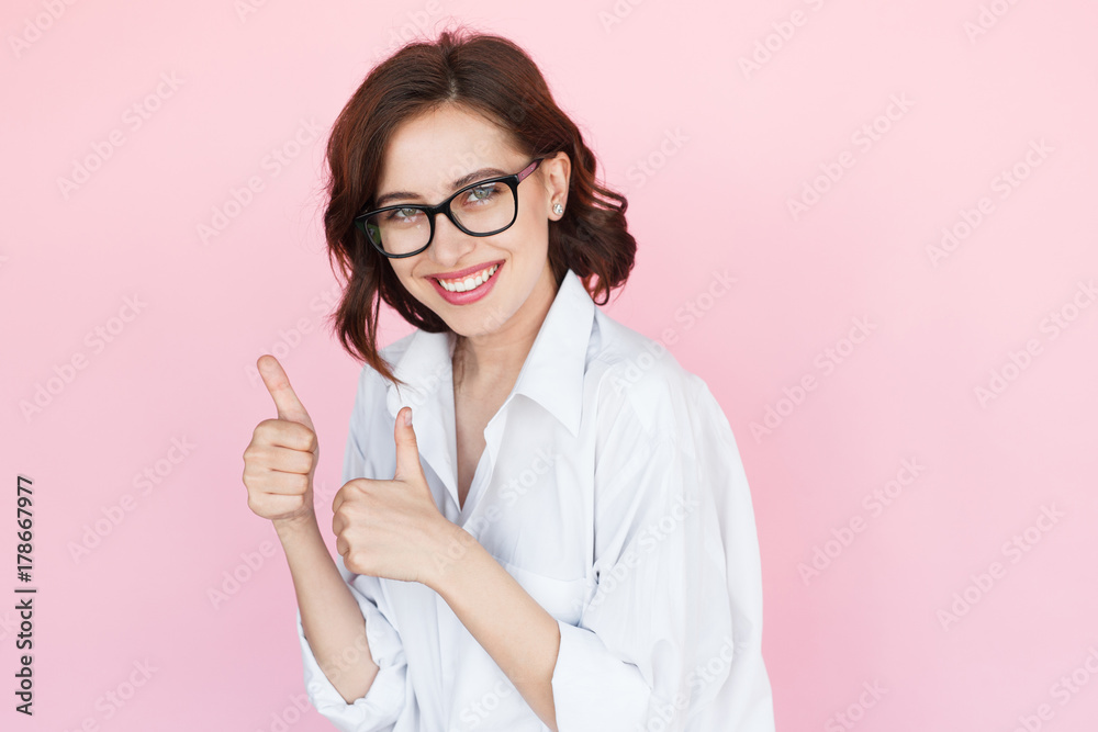 Content woman showing thumbs up Content woman showing thumbs up