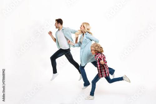 Full length portrait of a young modern family