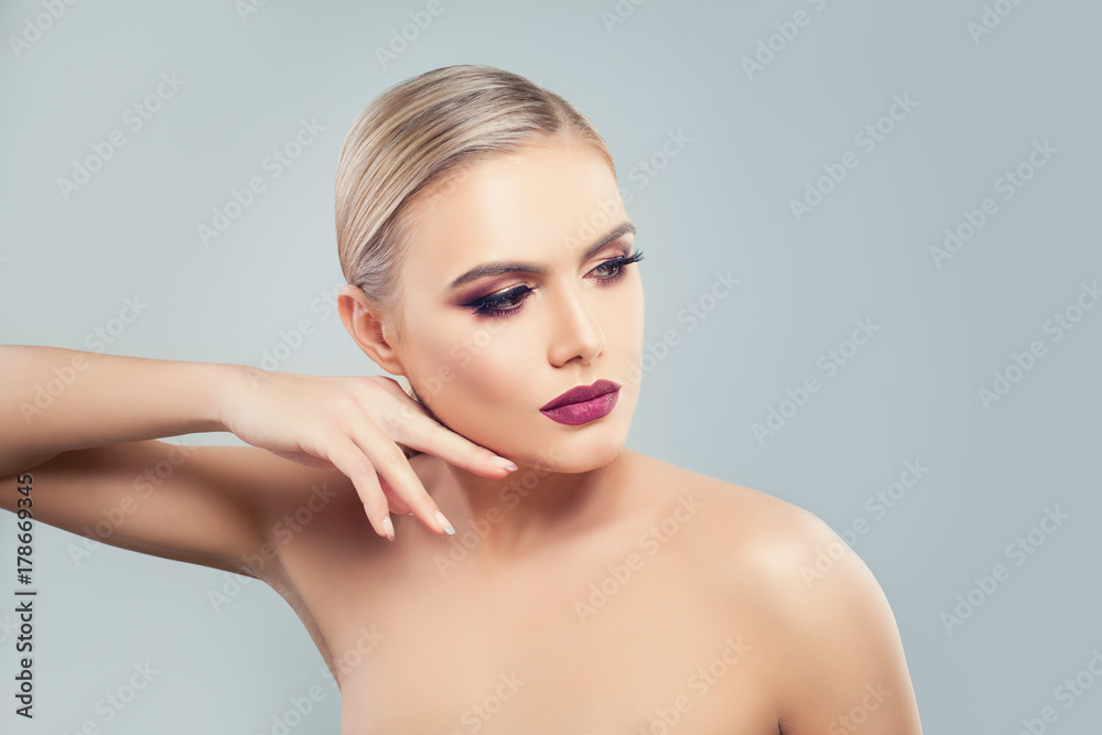 Beautiful Model Woman with Healthy Skin on Blue Background. Beauty, Facial Treatment and Cosmetology Beautiful Model Woman with Healthy Skin on Blue Background. Beauty, Facial Treatment and Cosmetology