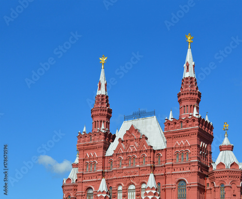 State Historical Museum on Red Square, Moscow, Russia, museum of Russian history with beautiful architecture of facade of red brick with clear blue sky on the background, famous touristic landmark