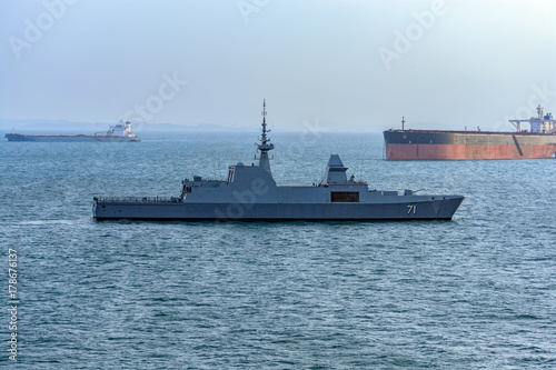 Modern battleship in Singapore Strait.