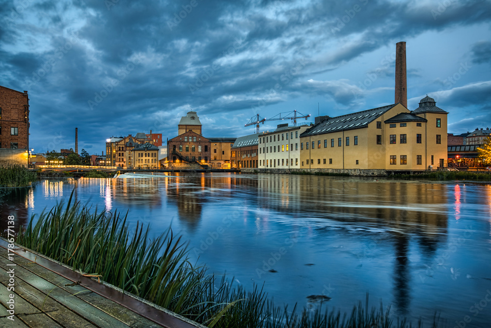 Historical textile industrial area and Motala river at dusk in Norrkoping, Sweden