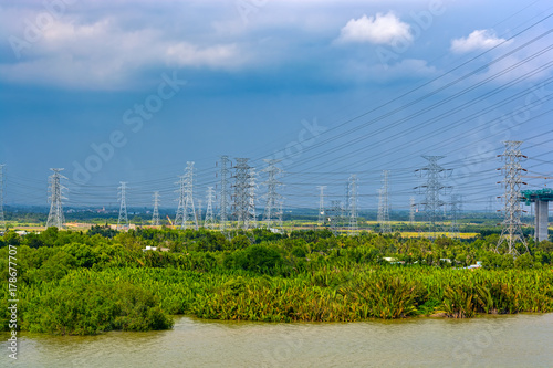 High-voltage power lines over jungle photo