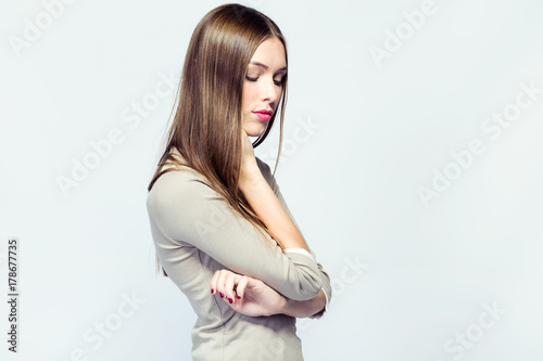 Beautiful young woman posing over white background. © nenetus