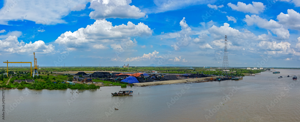 Coal stockpiles on Saigon river bank