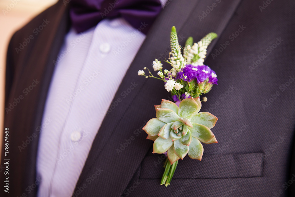Wedding boutonniere on suit of groom Wedding boutonniere on suit of groom