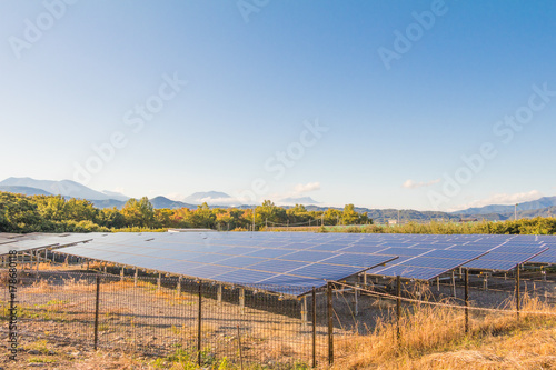 Solar power panels ,Photovoltaic modules for innovation green energy for life with blue sky background.