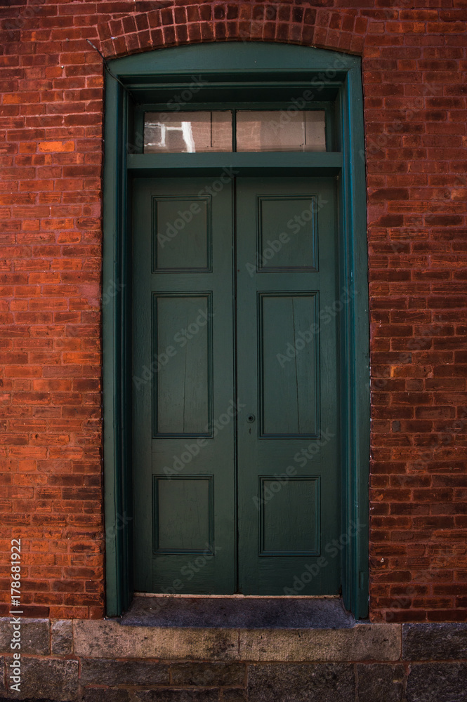 Green Door on Red Bricks