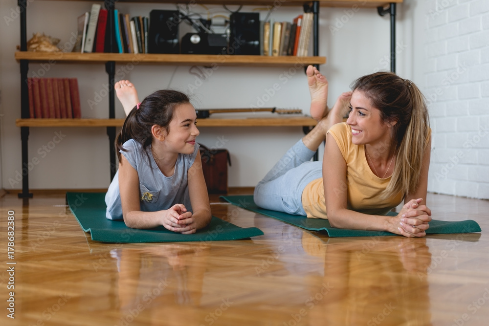 Mother and daughter enjoy after exercise Mother and daughter enjoy after exercise