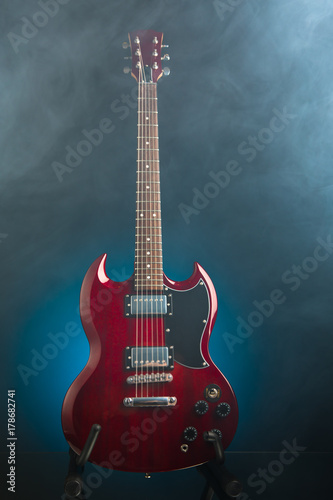 electric guitar in smoke, blue background