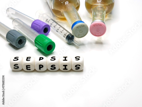 test tubes, syringe, hemoculture bottles, and silicone letters photo