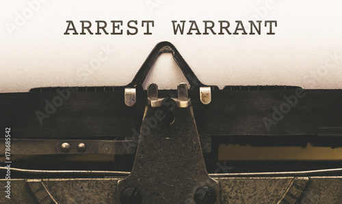 Arrest Warrant on vintage type writer from 1920s photo