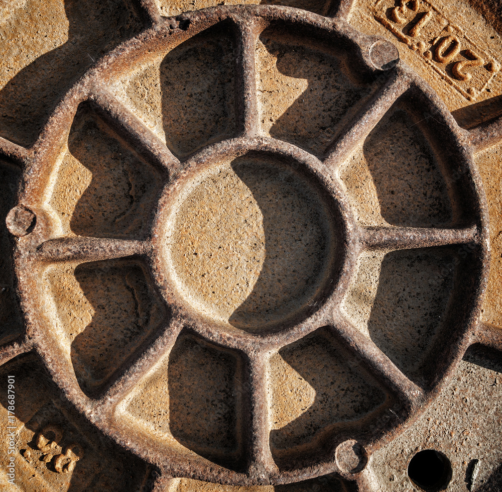 Old rusty manhole closeup. Rusty metal background Old rusty manhole closeup. Rusty metal background