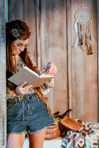 woman in boho style reading book