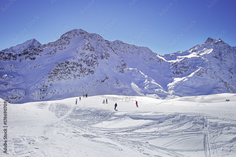 High mountains under snow in the winter. Slope on the skiing resort, European Alps