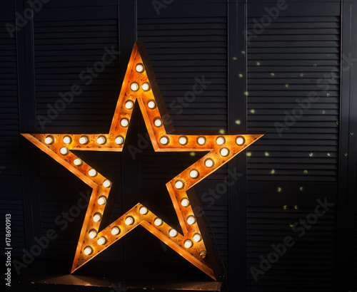 star of light bulbs on a dark background, rock star, incandescent light bulb