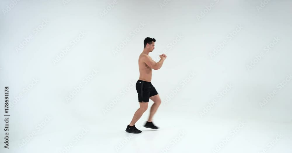 Young athletic man doing warm-up before exercise and jogging. 4k Young athletic man doing warm-up before exercise and jogging. 4k