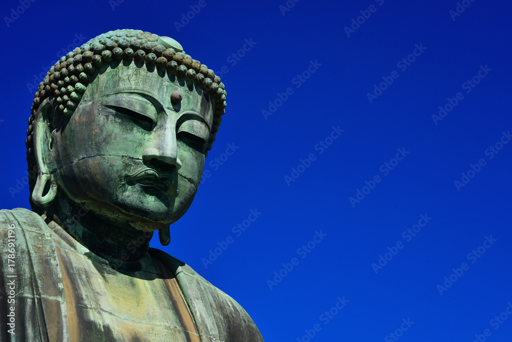 Great Buddha of Kamakura, an ancient bronze statue erected in 1252 near Tokyo, Japan (with copy space) Great Buddha of Kamakura, an ancient bronze statue erected in 1252 near Tokyo, Japan (with copy space)