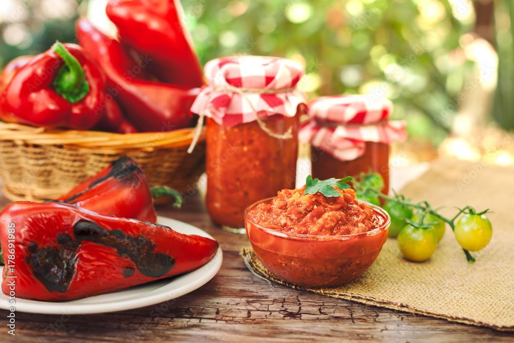 Homemade Ajvar served in jars and bowl Homemade Ajvar served in jars and bowl