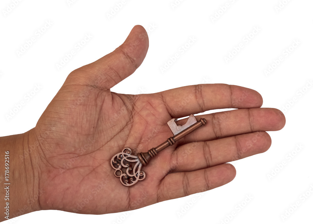 hand holding the key on white background. hand holding the key on white background.