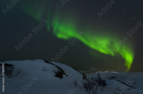 Night,winter, landscape, hills,tundra, and in the sky the stars, Aurora. © Moroshka