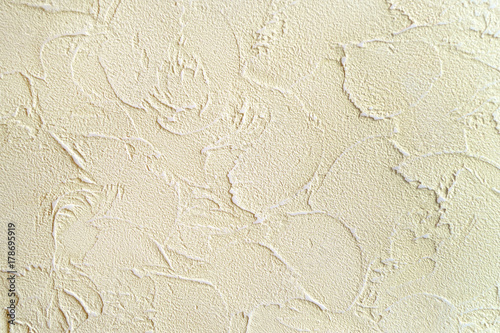 Wall covered beige plaster, background, texture