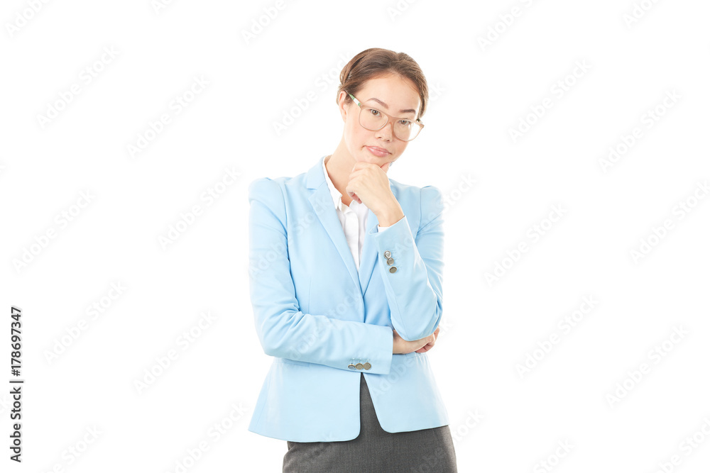Studio portrait of Asian businesswoman in eyeglasses posing on white background