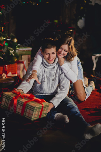 Couple sitting at home on new year's Eve photo