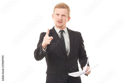 Portrait of young manager in black suit holding document on white background