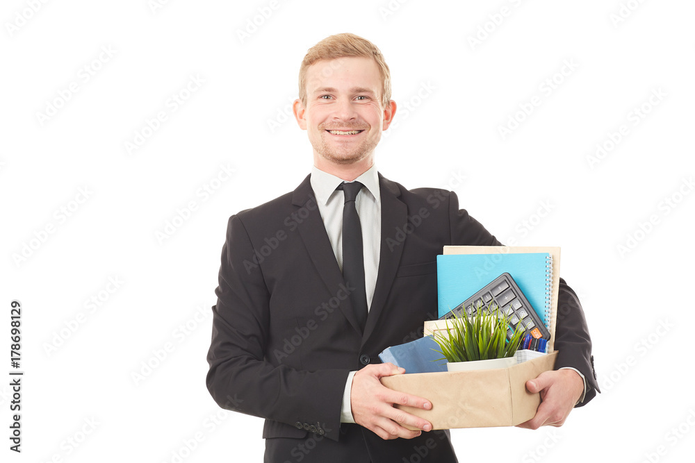 Portrait of young man holding box with personal belongings on white background Portrait of young man holding box with personal belongings on white background