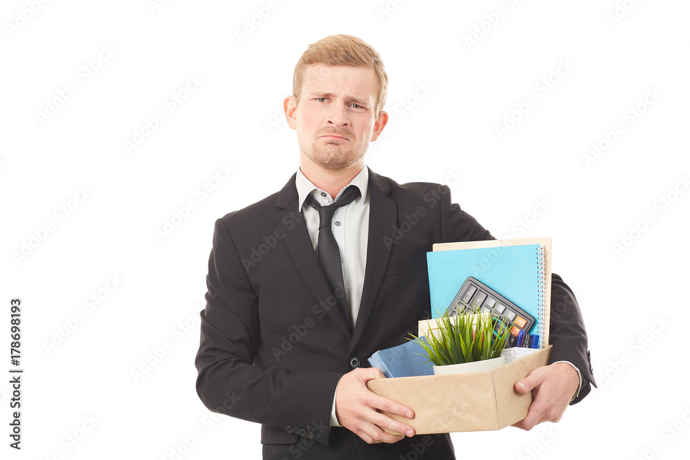Portrait of young man holding box with personal belongings on white background Portrait of young man holding box with personal belongings on white background
