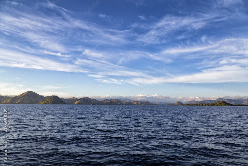 Early morning blue waters and sky off the coast of Rinca Island in the Komodo National Park.