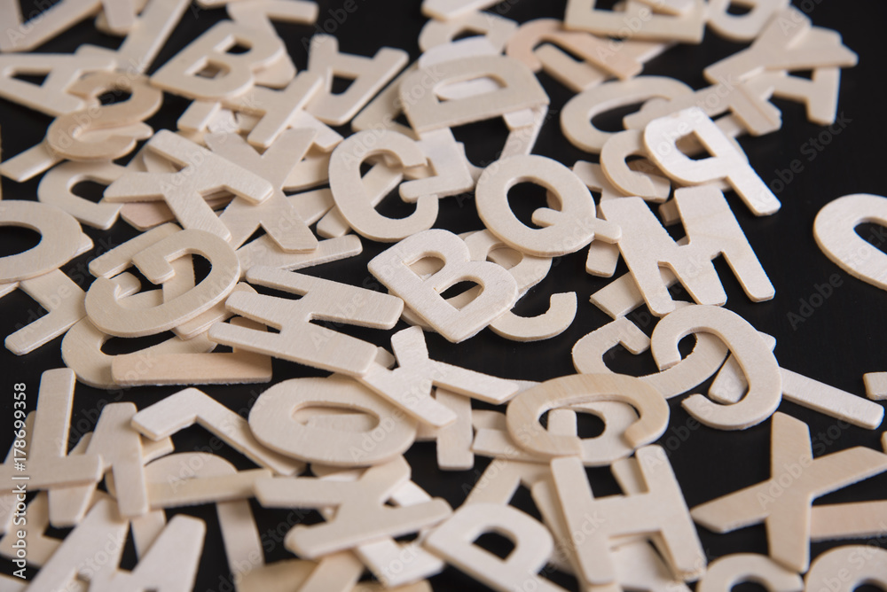 brown wood english alphabet on table. brown wood english alphabet on table.