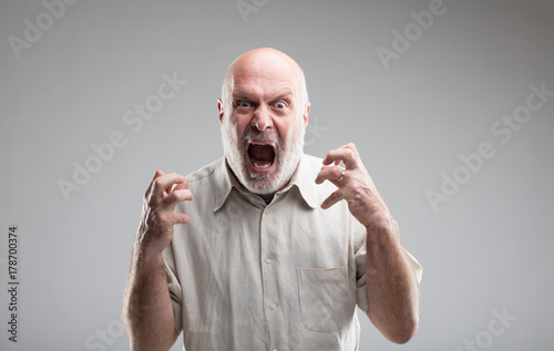 angry old man getting crazy or a wolf
